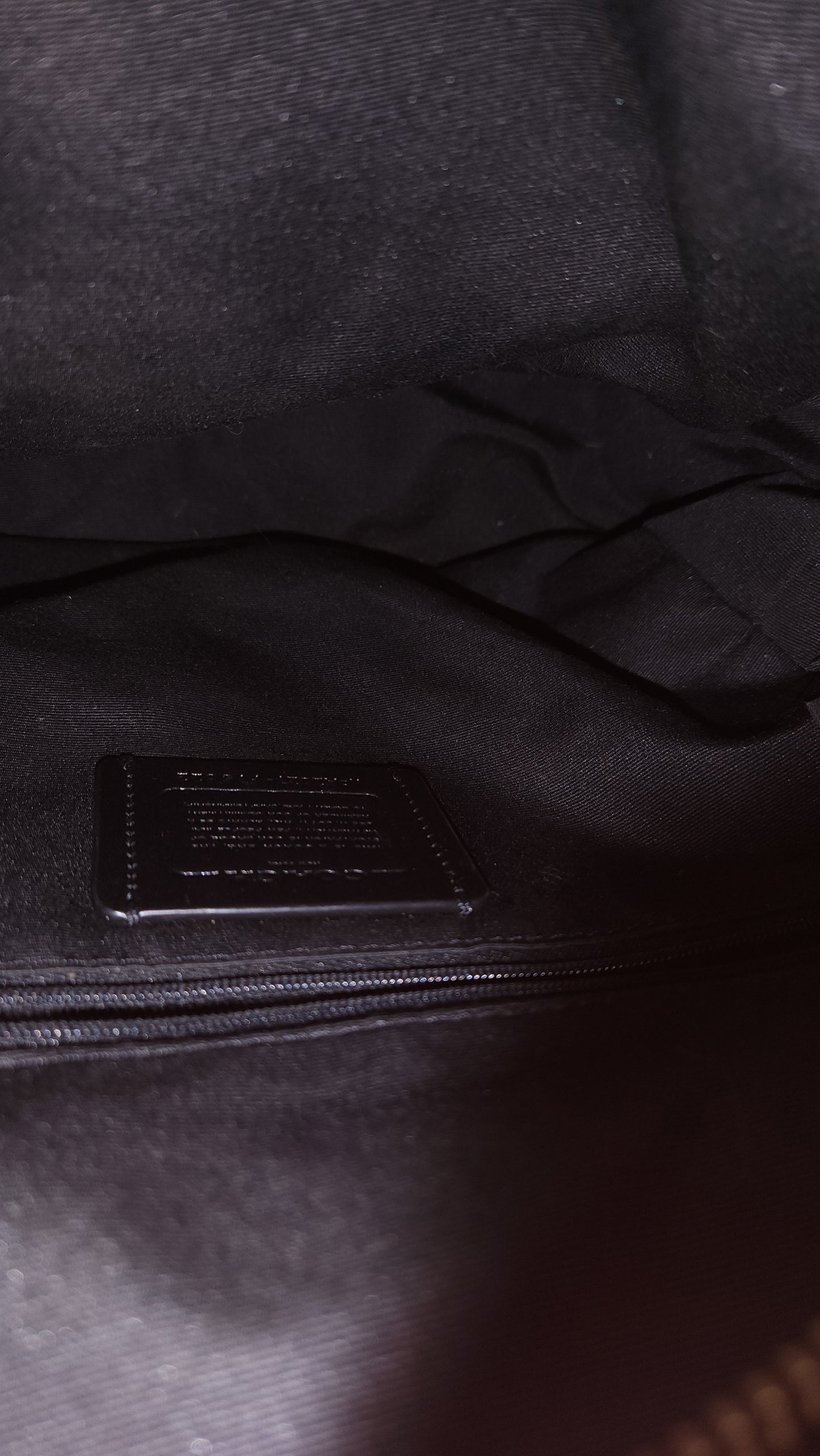 Mochila Coach Negra con Detalles en Café y Canvas